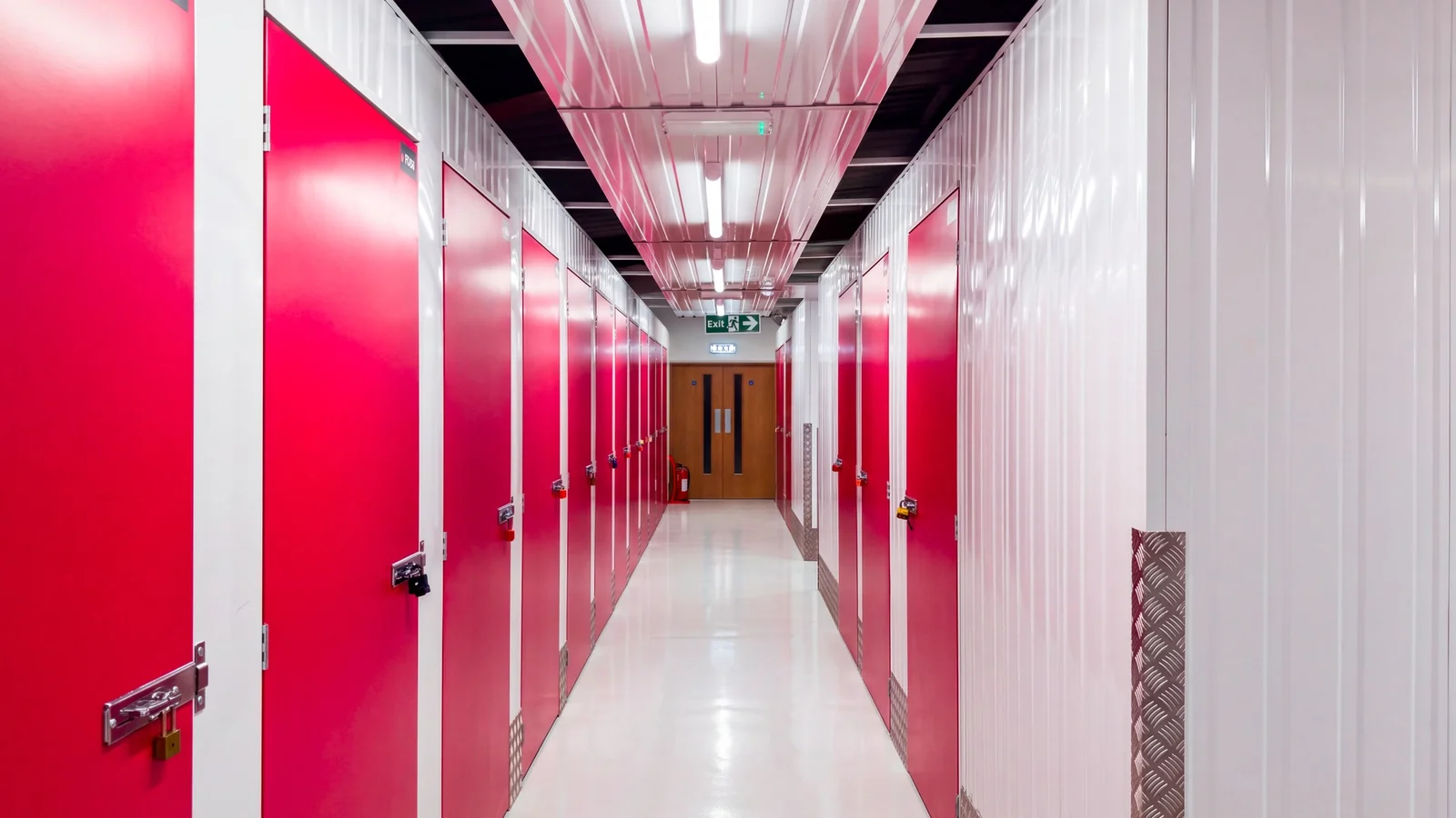Secure indoor storage units with bright pink doors at The Store Hub in Darlington.